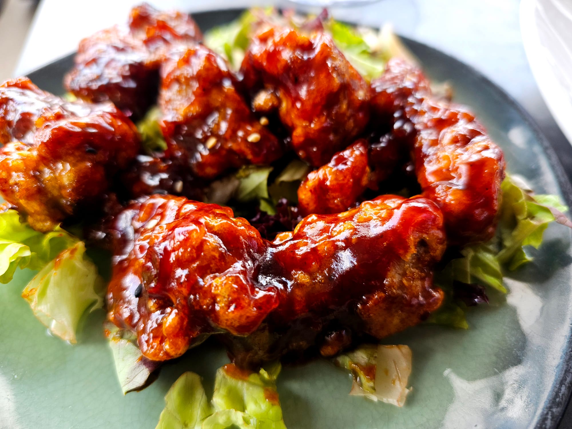 Glazed Iberico ribs on a bed of lettuce 