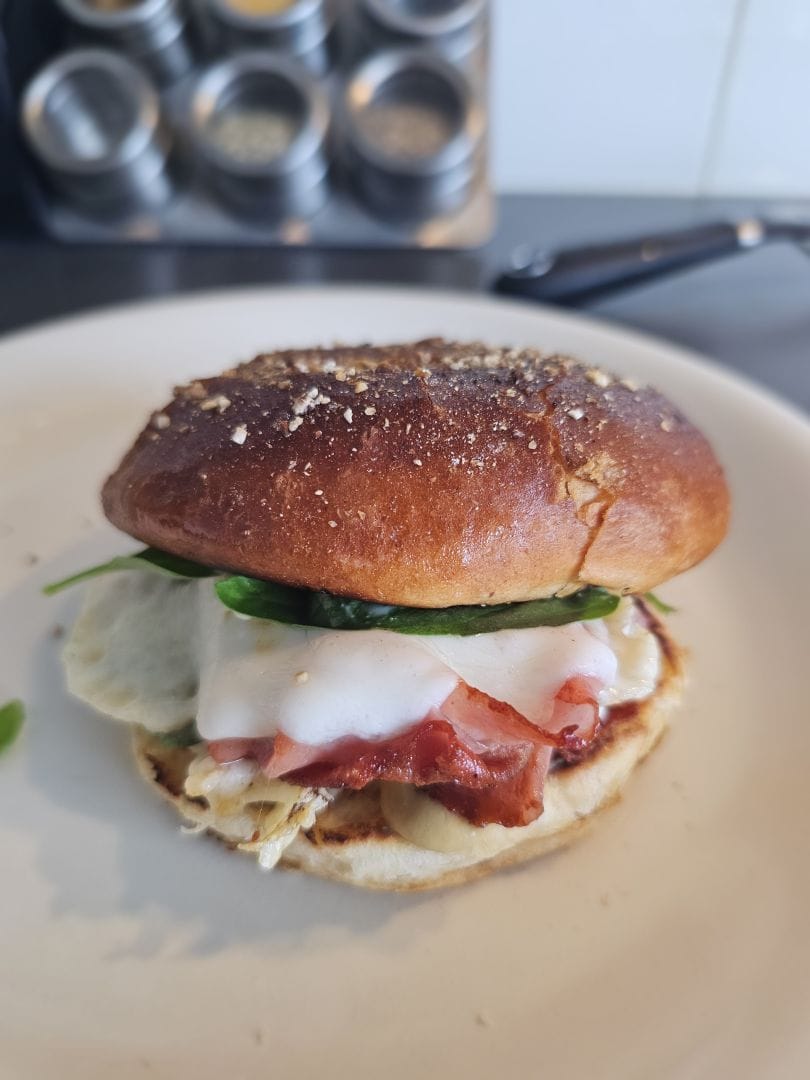 A mortadella and provolone burger, with a few basil leaves for fun.